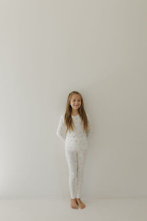 Bamboo two-piece pajamas for kids, promoting autism awareness, featuring Charli Counts design, shown at angle 8.