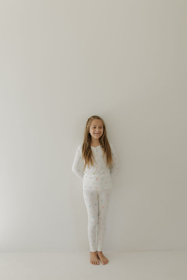 Bamboo two-piece pajamas for kids, promoting autism awareness, featuring Charli Counts design, shown at angle 8.