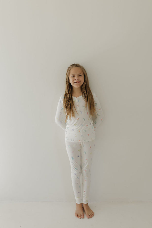 Bamboo two-piece pajamas for babies, promoting autism awareness, featuring Charli Counts design at angle 10.