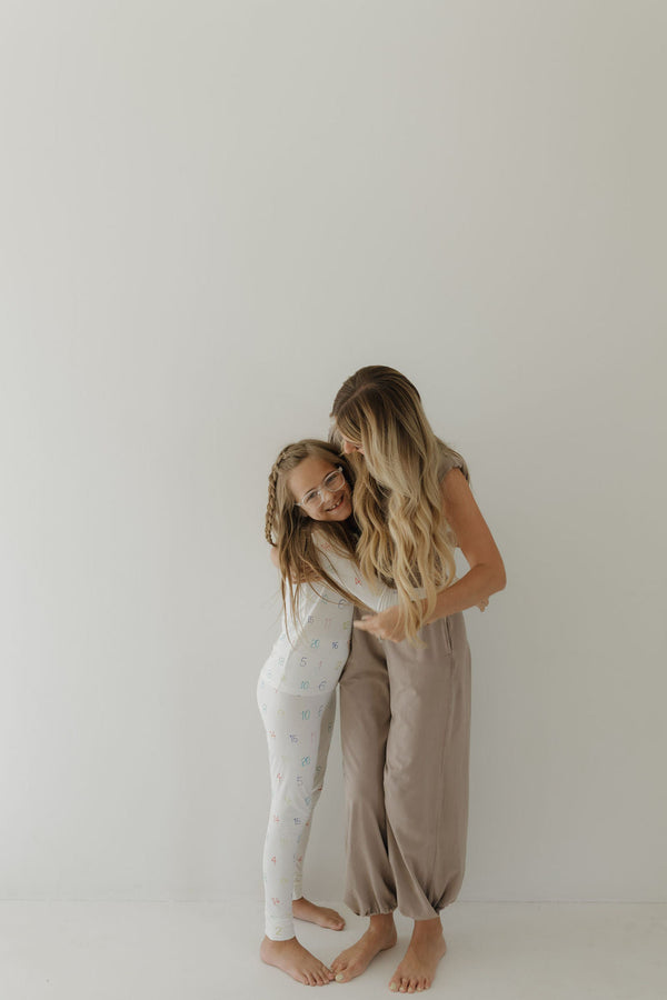 Bamboo two-piece pajamas for kids, featuring autism awareness design by Charli Counts, shown at angle 7.