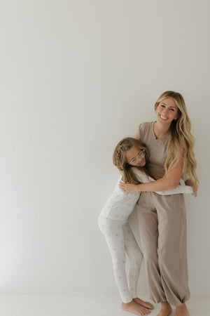 Bamboo two-piece pajamas for babies, featuring autism awareness design by Charli Counts, shown at angle 9.