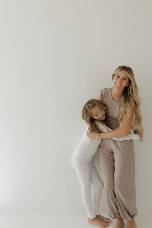 Bamboo two-piece pajamas for babies, featuring autism awareness design by Charli Counts, shown at angle 9.