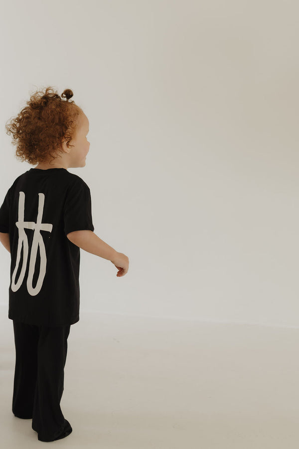 Toddler black bamboo lounge set, short sleeve pajamas, angle 3 view, soft and stylish sleepwear for kids.