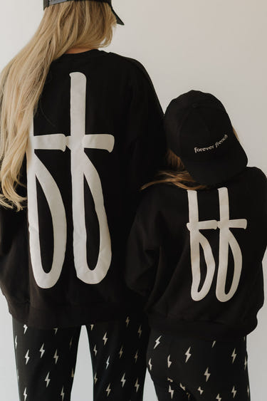 Black child sweatshirt for cozy comfort and style. Perfect for everyday wear.