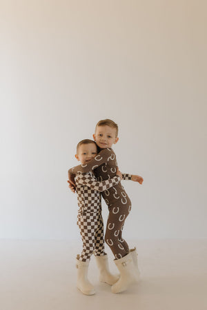 Bamboo two-piece pajamas for babies by Giddy Up, featuring a cozy design and soft fabric.