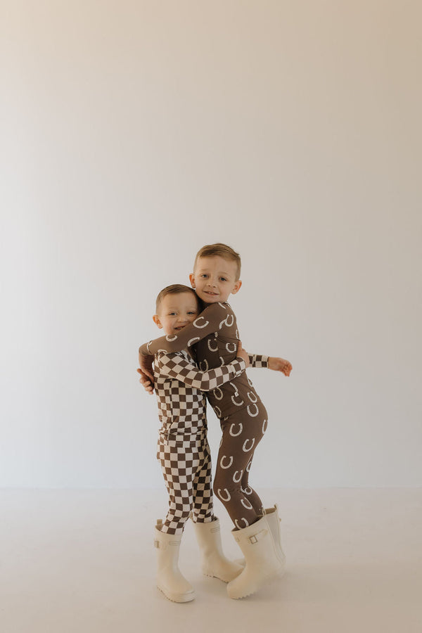 Bamboo two-piece pajamas for babies by Giddy Up, featuring a cozy design and soft fabric.