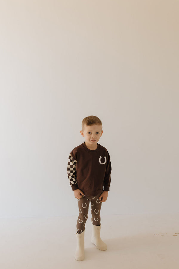 Bamboo two-piece pajamas for babies by Giddy Up, featuring a cozy design in a playful angle view.
