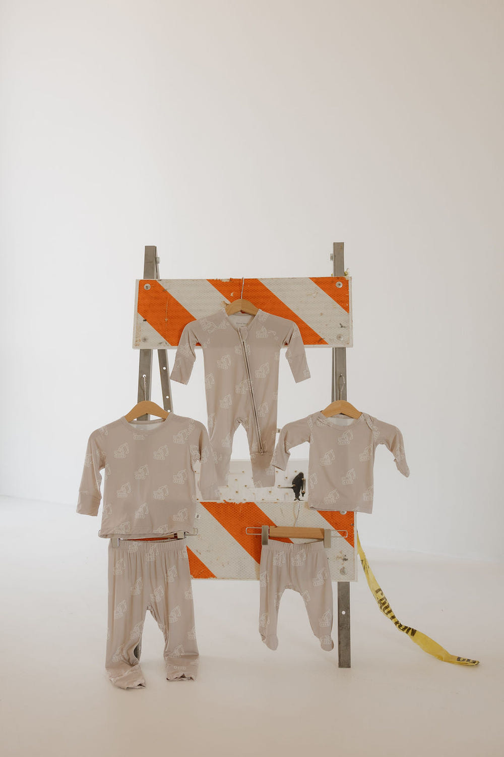 Bamboo zip pajamas for babies featuring a fun excavator design. Soft, breathable, and perfect for cozy sleep.