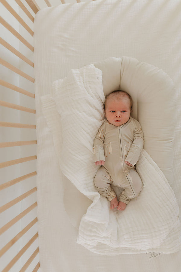 Bamboo Zip Pajamas by Silly Goose, angle view showcasing soft, eco-friendly fabric for babies.