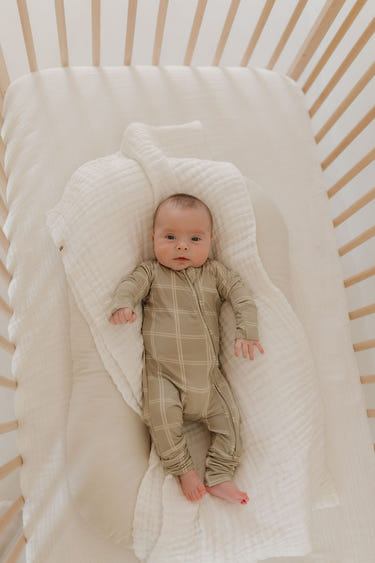 Bamboo zip pajamas in linen grid design for babies, soft and breathable for comfortable sleep.