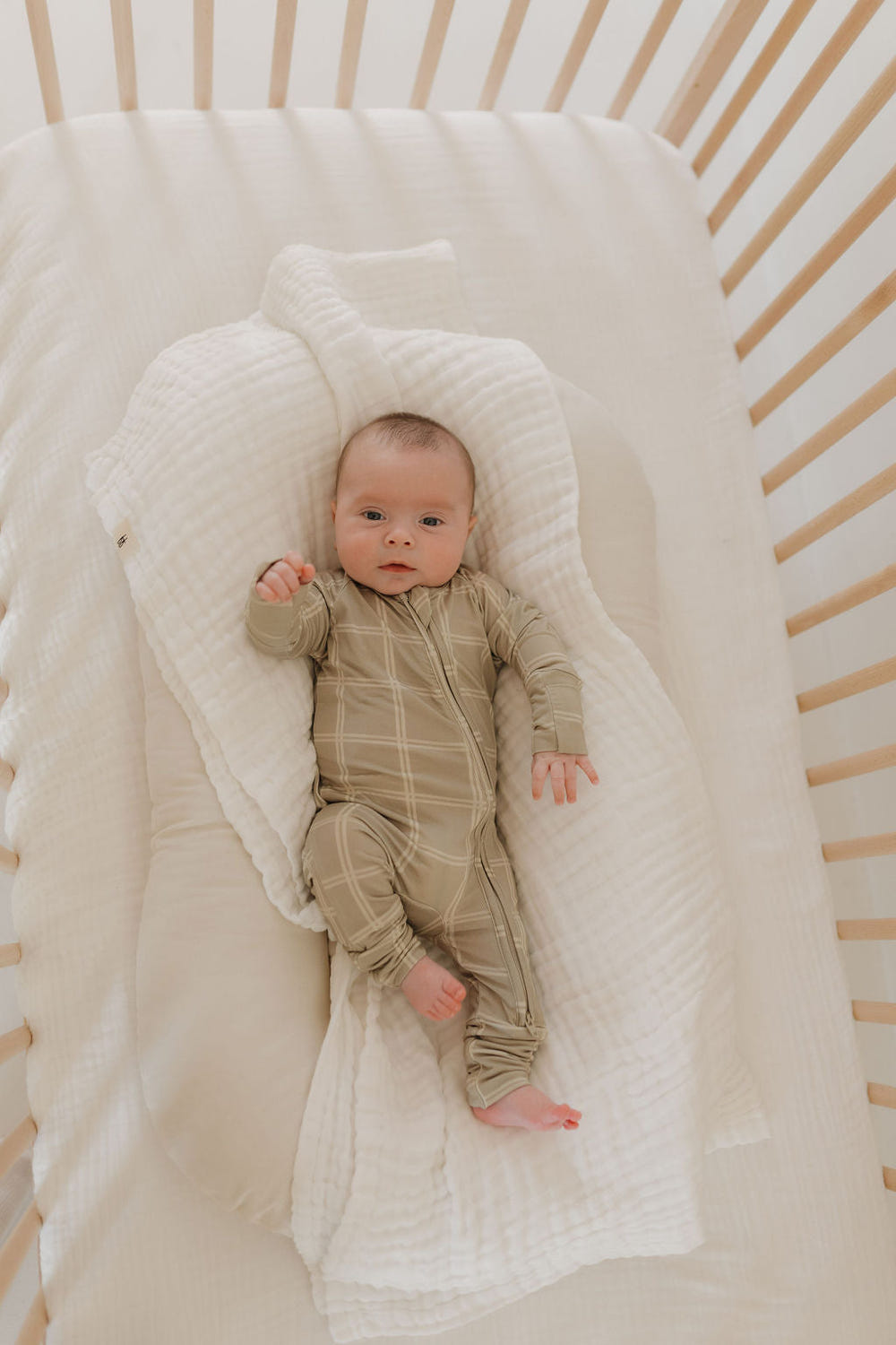 Bamboo zip pajamas in linen grid design for babies, soft and breathable for comfortable sleep.