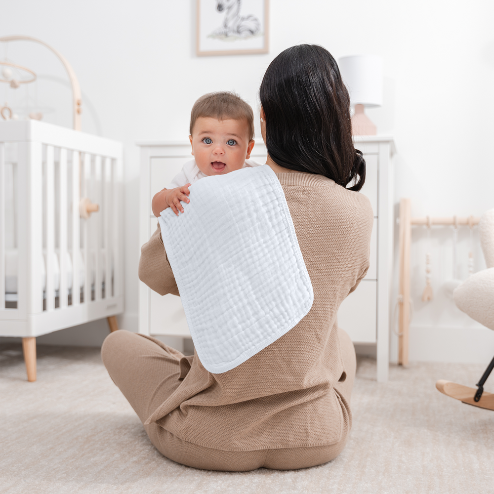 White muslin burp cloths for babies, soft and absorbent, perfect for feeding and clean-up.