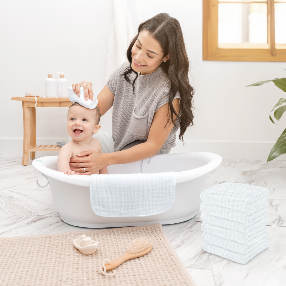 Soft white muslin washcloths for babies, perfect for gentle cleaning and bath time.