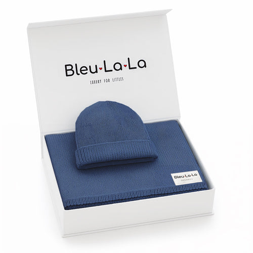 Luxe Collection organic cotton baby blanket and hat set in gift box, angled view showcasing soft knit design.