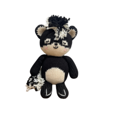 Adorable baby skunk knit doll, perfect for cuddles and imaginative play.