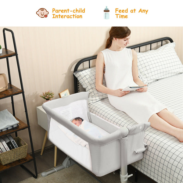 Portable baby bed side sleeper bassinet crib with carrying bag, perfect for travel and safe sleep.