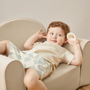 Tiny Land® GentleSnug Kid Chair in Beige White, perfect for kids' seating, shown from angle 3.