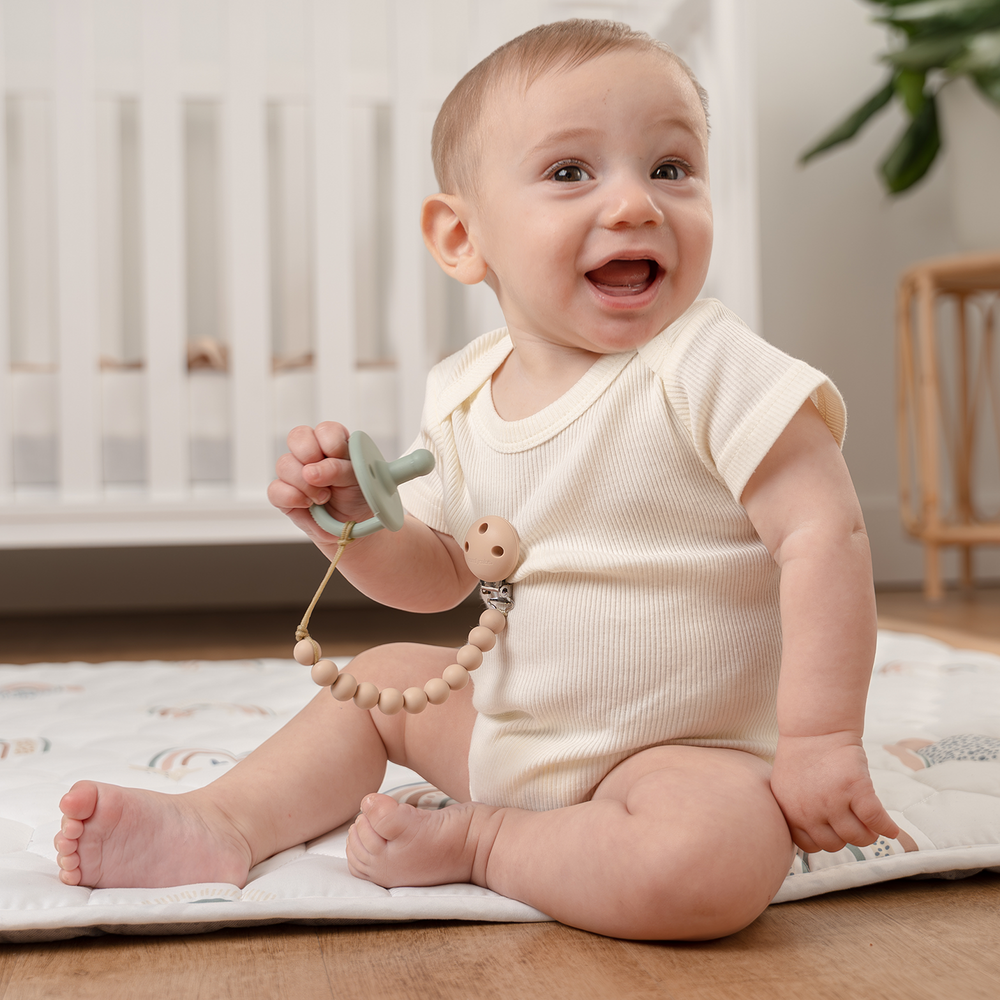Beige pacifier clips, 2 pack, perfect for keeping pacifiers clean and within reach.