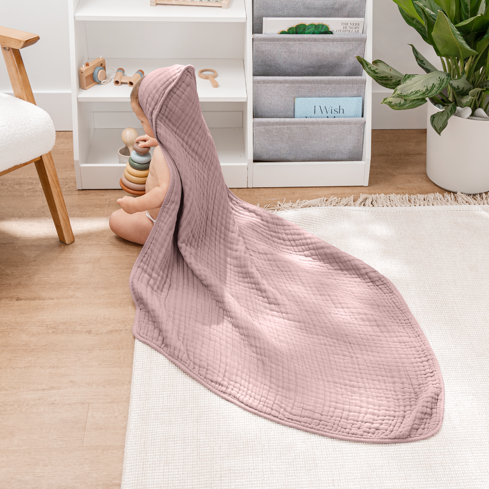 Mauve baby hooded towels, soft and cozy, perfect for bath time and keeping little ones warm.