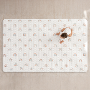 Rainbow play mat with non-slip bottom, angled view, perfect for safe and fun baby playtime.