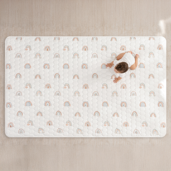 Rainbow play mat with non-slip bottom, angled view, perfect for safe and fun baby playtime.