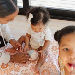 "Blooms Vegan Leather Play Mat at angle 18, perfect for stylish and safe baby playtime."