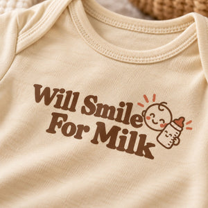 Close-up of the Will Smile For Milk baby bodysuit print