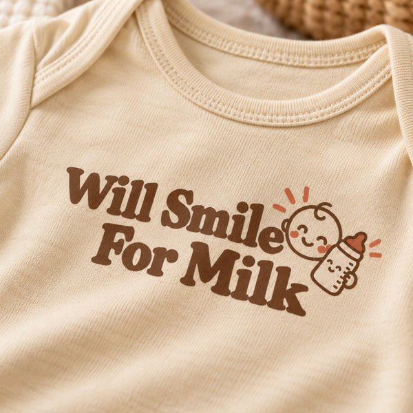 Close-up of the Will Smile For Milk baby bodysuit print