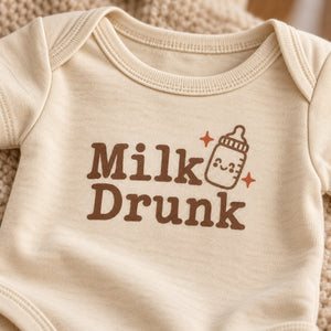 Close-up of the Milk Drunk baby bodysuit print