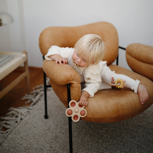 Colorful flower press toy for babies, promoting creativity and fine motor skills, viewed at angle 17.