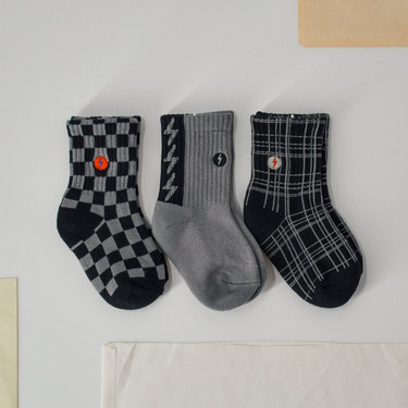 "3-pack 'Check the Volts' baby socks in fun designs, perfect for keeping little feet cozy and stylish."