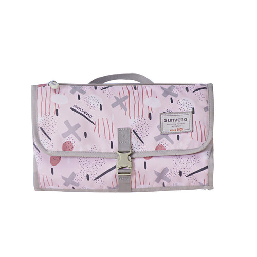 Foldable changing pad for easy diaper changes, shown from angle 2, compact and portable for parents on the go.