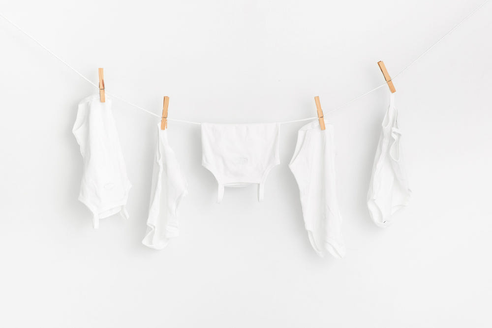 Baby boy sleeveless undershirts, 3-pack bodysuits in soft cotton, perfect for comfort and layering.