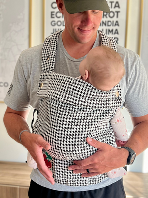Coco Houndstooth woven jacquard baby carrier for 7-35 lbs, shown from angle 2, stylish and comfortable for parents.