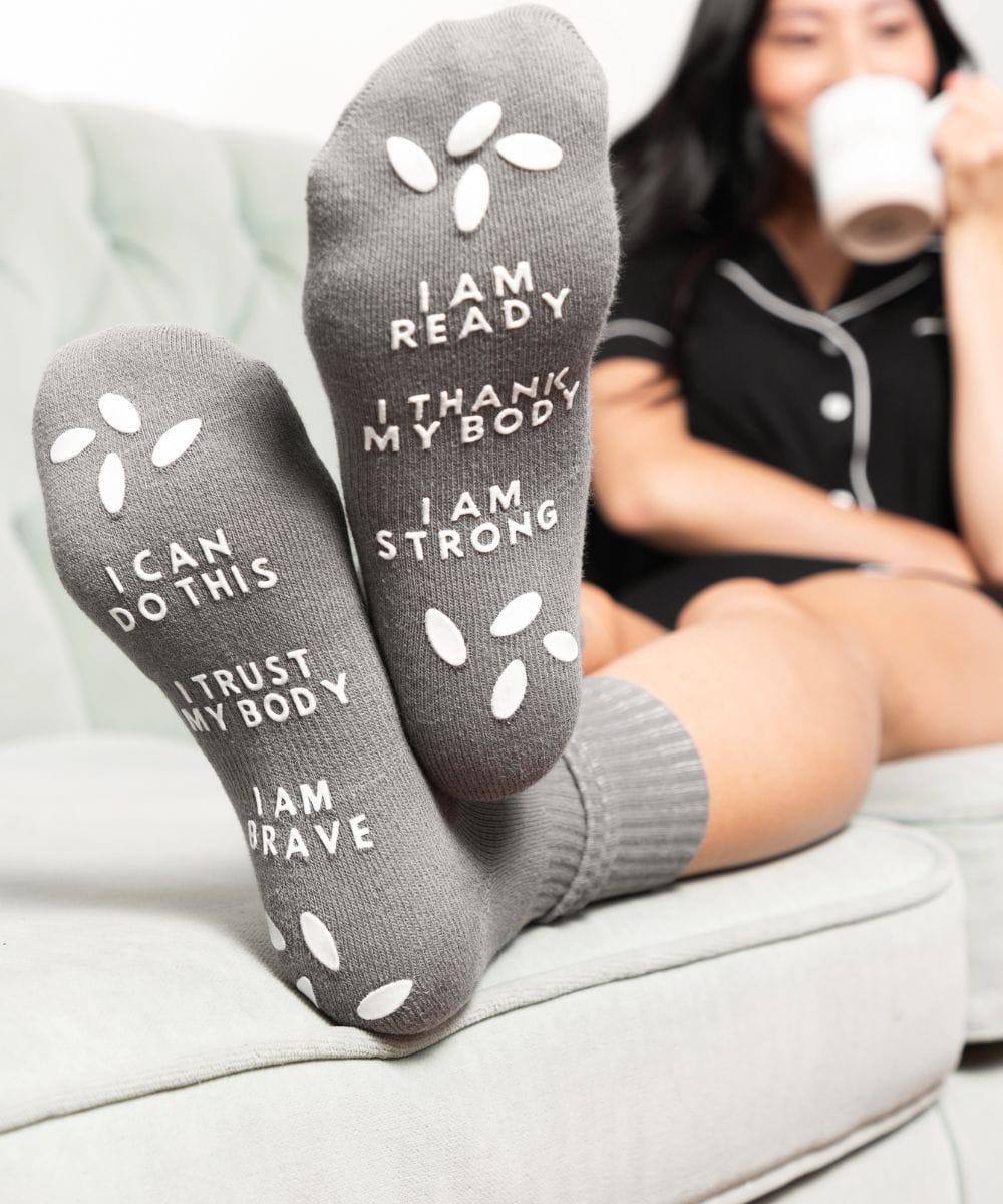 Birthing affirmation hospital socks for comfort and positivity during labor and delivery.