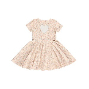 Sweetheart Twirl Dress in Sunset Meadow, organic cotton jersey, perfect for baby swimwear. Angle 6 view.