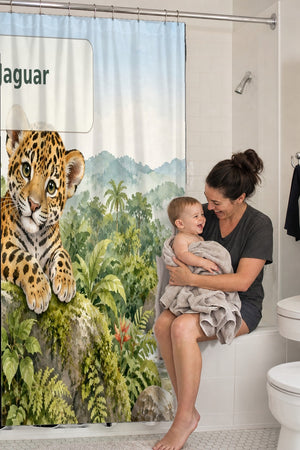 Mom holding her baby on the tub edge next to the J is for Jaguar Alphabet shower curtain