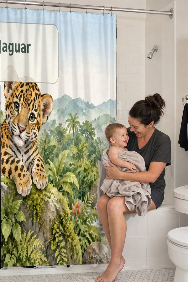 Mom holding her baby on the tub edge next to the J is for Jaguar Alphabet shower curtain