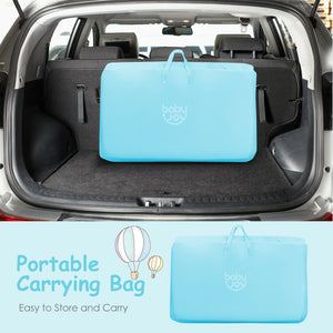 Portable baby bed side sleeper bassinet crib with carrying bag, angled view for travel convenience.