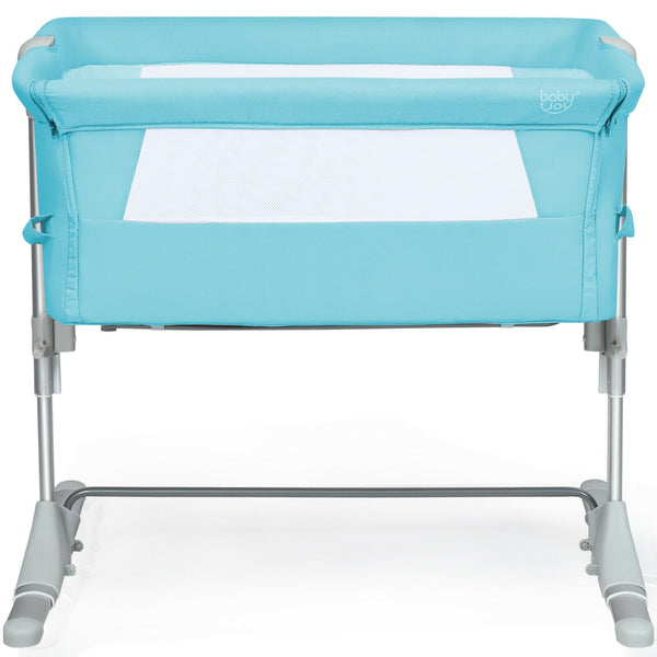 Portable baby bed side sleeper bassinet crib with carrying bag, angled view showcasing its compact design.