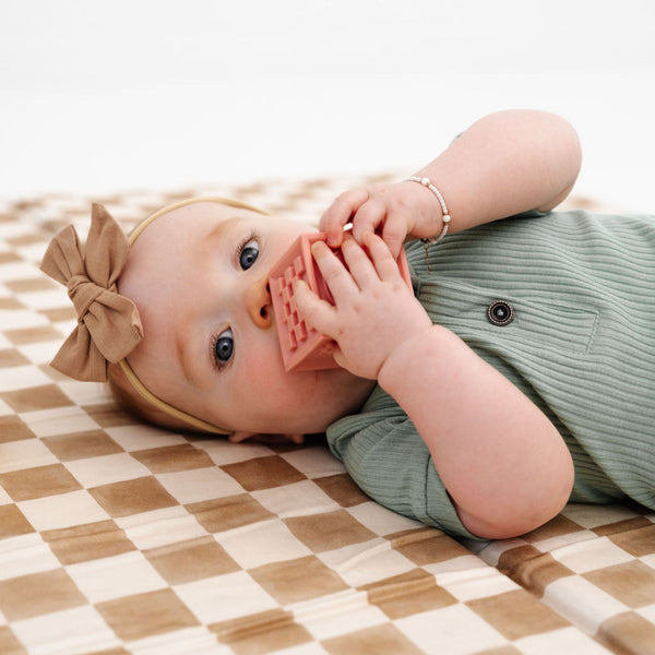 Checker Toffee Organic Cotton Mat for babies, perfect for playtime, featuring a stylish design and soft texture.
