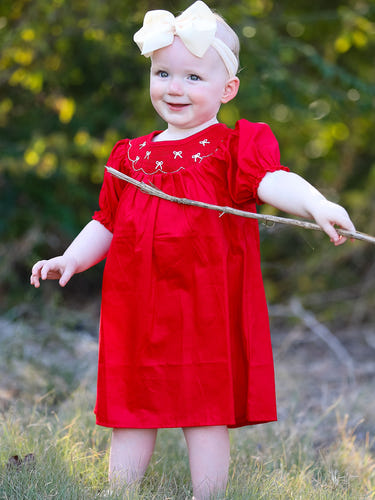 Girls red dress with bow smocking and embroidery, perfect for special occasions.