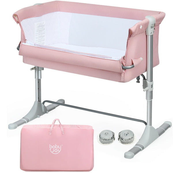 Portable baby bed side sleeper bassinet crib with carrying bag, angled view showcasing its compact design.