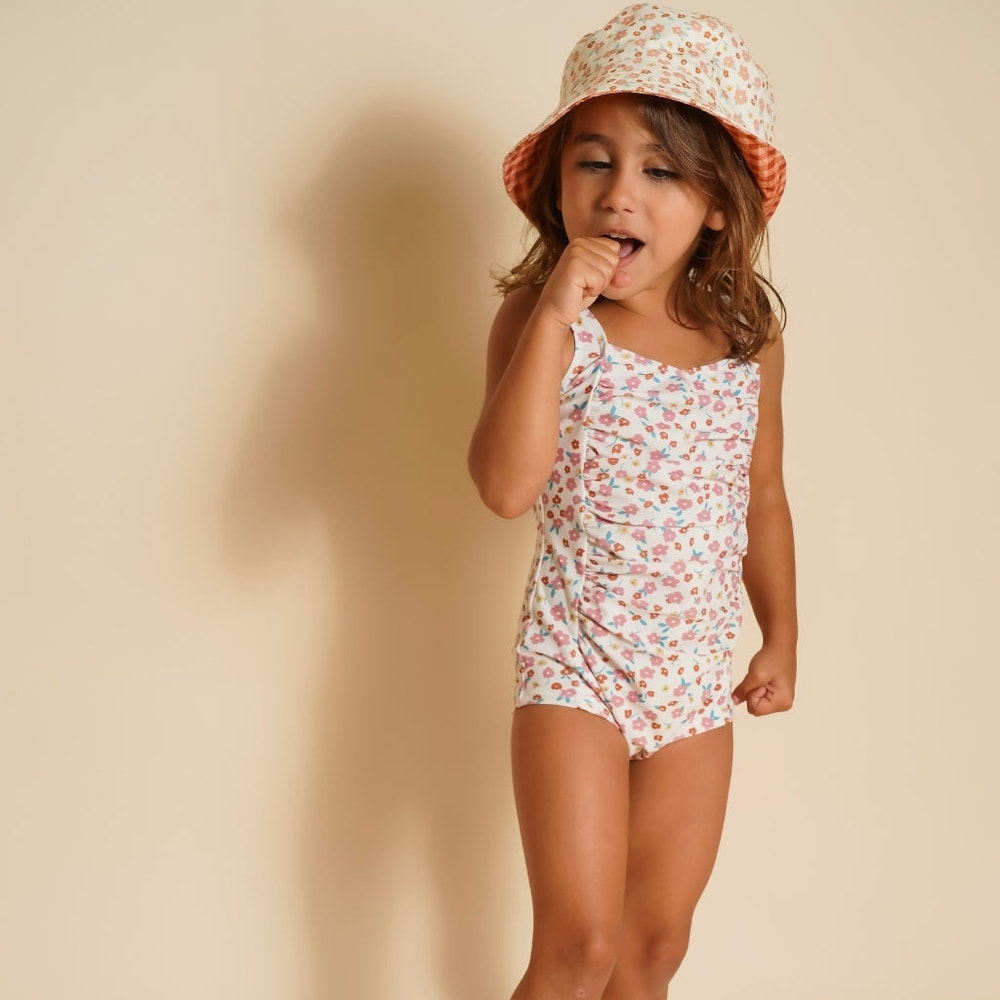 Vintage girls' 1 piece swimsuit in Sunset Meadow, UPF protected and made from recycled materials. Perfect for summer fun!