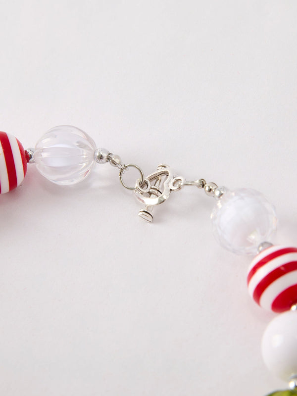 Cute vintage cherry pendant necklace for babies, perfect accessory for seasonal wear. Angle 3 view.