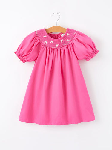 Girls hot pink dress with bow smocking embroidery, perfect for special occasions and everyday wear.