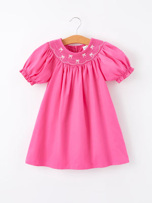 Girls hot pink dress with bow smocking embroidery, perfect for special occasions and everyday wear.