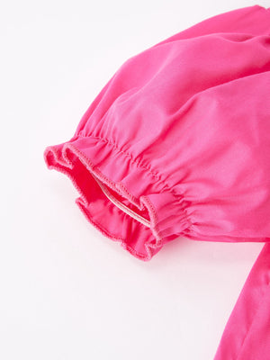 Girls hot pink dress with bow smocking embroidery, showcased from angle 4. Perfect for special occasions.
