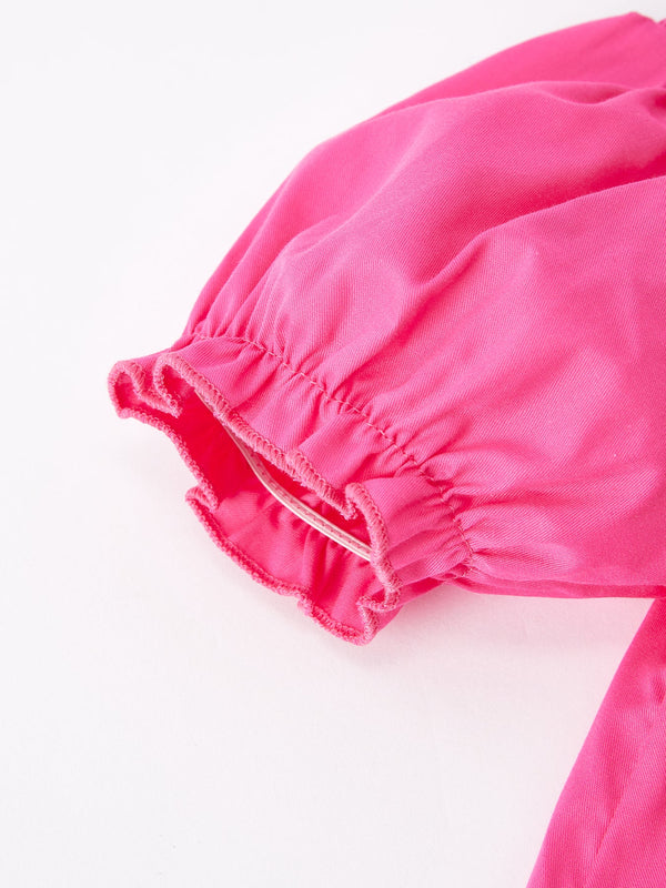 Girls hot pink dress with bow smocking embroidery, showcased from angle 4. Perfect for special occasions.