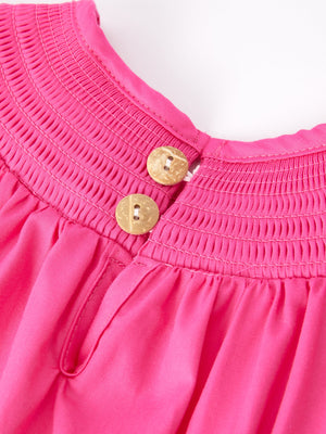 Hot pink girls' dress with bow smocking embroidery, showcased from angle 5. Perfect for special occasions!